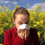 girl in field with allergies